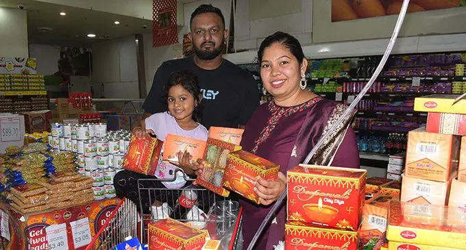 Shimmeon Raj with wife Poonam and daughter Ahana Raj shop for their diya light for Diwali pooja (prayer) at MHCC outlet in Suva on October 21, 2022. Photo: Nicolette Chambers