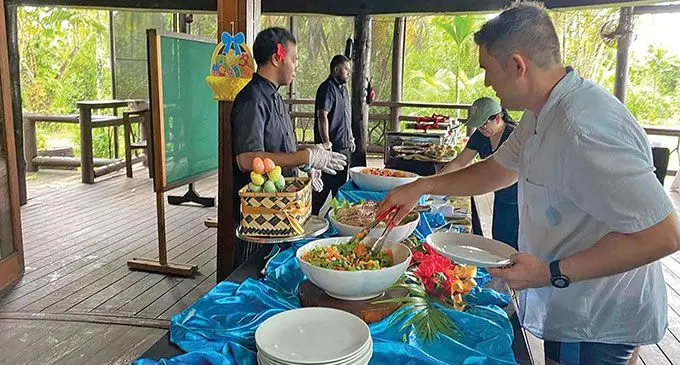 Guests help themselves to lunch at the Uprising Beach Resort. Photo: Uprising Beach Resort
