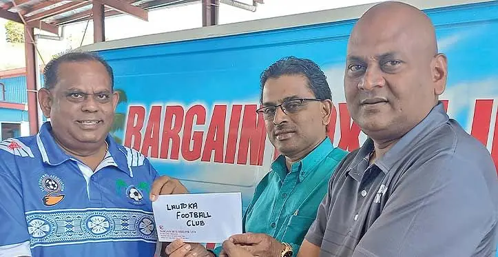 Bargain Box managing director Ratish Roy (right) hands over sponsorship cheque to Lautoka Football Association president Shalendra Prasad while Lautka FA financial controller Dinesh Chand looks on in Lautoka on August 9, 2023. Photo: Charles Chambers
