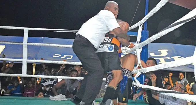 Referee Jerry Ledua pulls back Ronald Naidu as Nathan ‘The Hornet’ Singh goes down in the 10th round at Prince Charles Park, Nadi, on March 20,2021. Photo: Waisea Nasokia