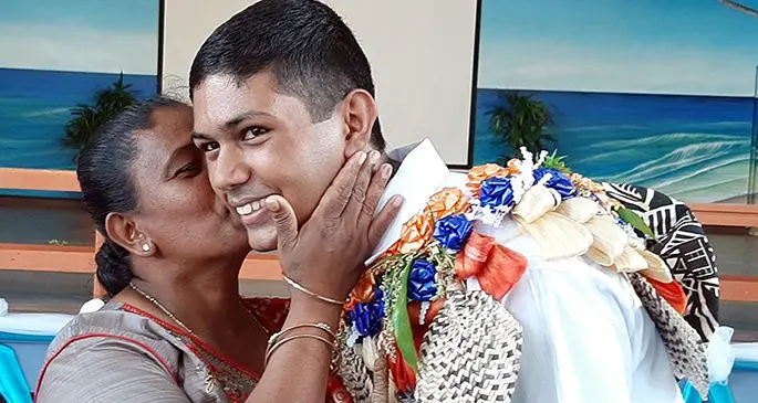 Natabua High School head boy Avinash Chand congratulated by his mother, Roshni Kiran Lata. Photo: Natabua High School.