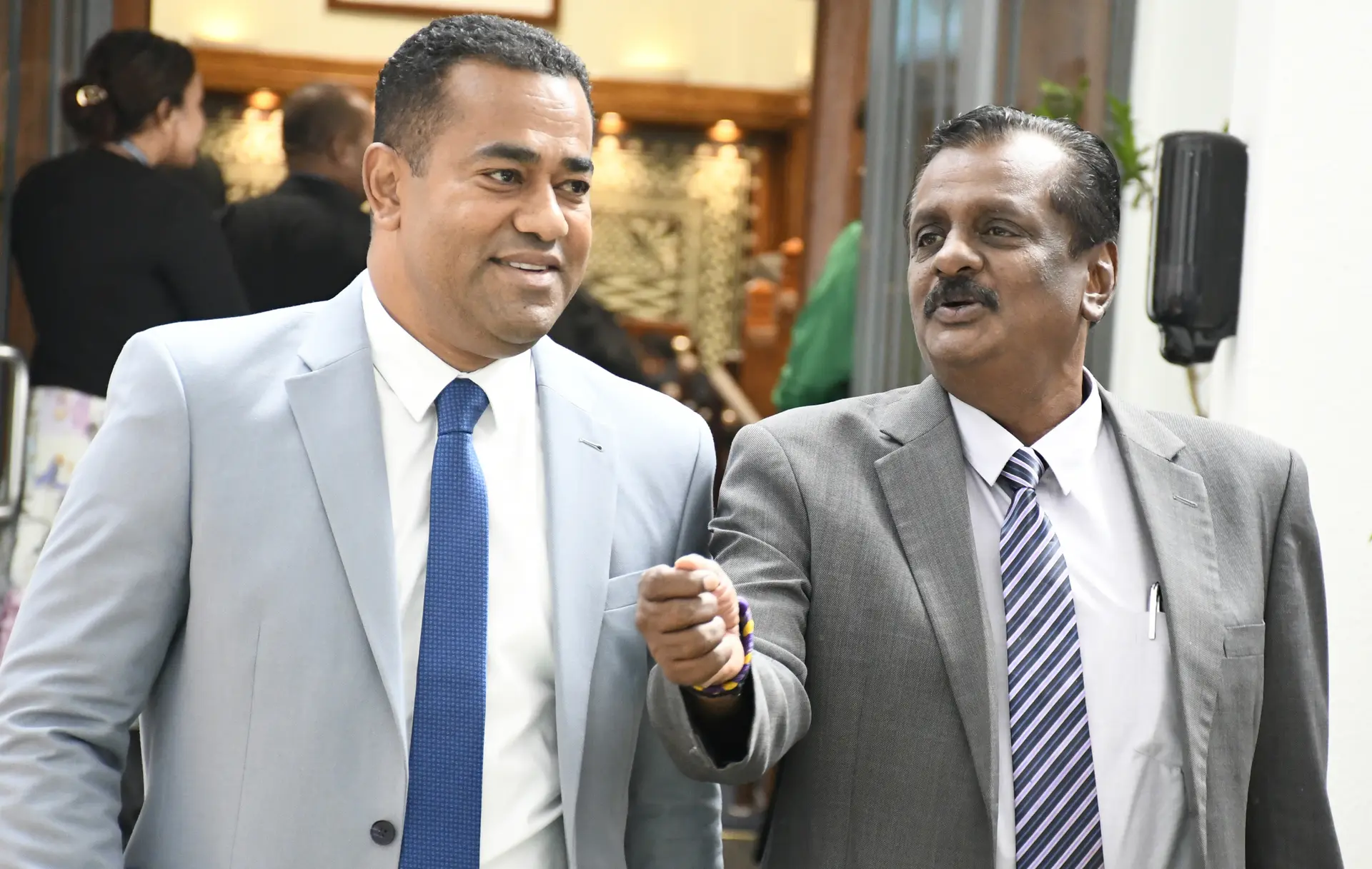 Minister for Lands and Mineral Resources Filimoni Vosarogo (left), with Opposition Member of Parliament Parveen Bala outside Parliament on April 29, 2026.