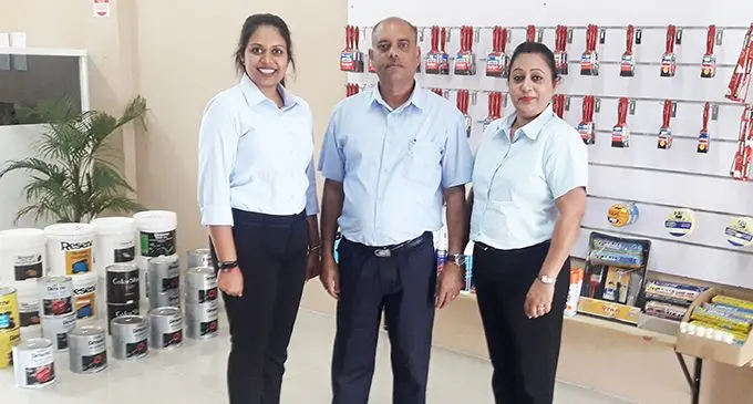 Brahma Nand with wife Pranita (right) and daughter Payal (left) at their new paint shop Colour Perfect Paints. Photo: Charles Chambers