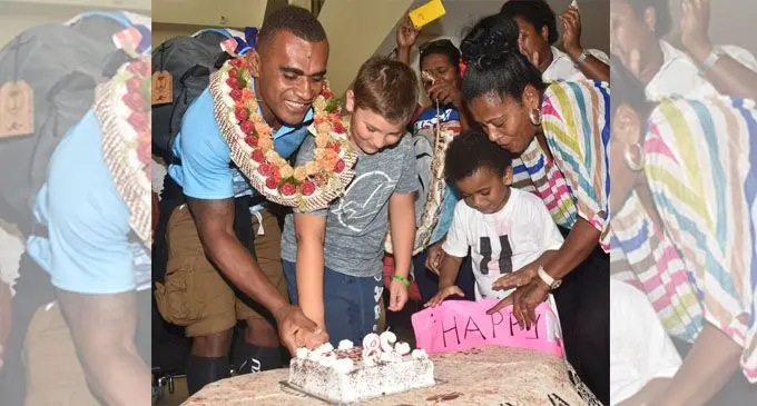 Fiji Airways 7s rep Eroni Sau with Gareth Baber’s son, Steffan and fans as the two celebrates their birthday at the Nadi International Airport on February 5, 2018 . Photo: Waisea Nasokia.