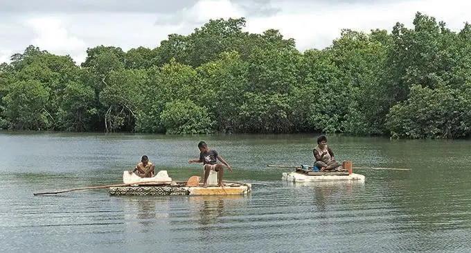 Ilisapeci Rokosovu and her nephews Taniela and Sailosi Rokoiri fish in front of their home in Tamavua-i-Wai.  Photo: Ivamere Nataro