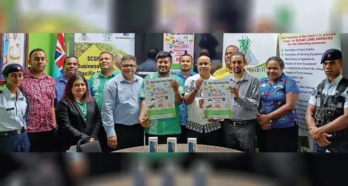 Sugar Cane Growers Fund chief executive officer, Raj Sharma (sixth from left) with the staff of the SCGF and invited guests in Lautoka on December 21, 2022. Photo: Nicolette Chambers 