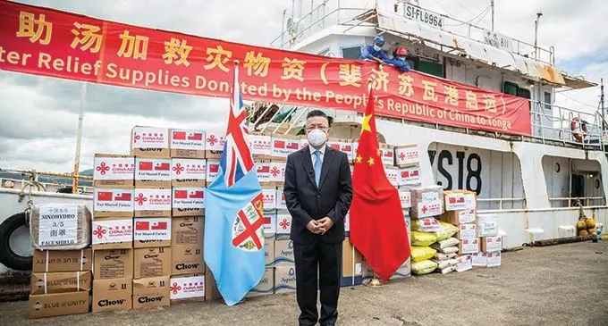 Ambassador of the People’s Republic of China to Fiji, Qian Bo with the fishing vessel Zhong Shui and relief supplies at Port Muaiwalu in Suva on January 24, 2022.   Photo: Leon Lord