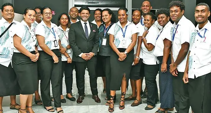 Attorney-General and Minister for Communications Aiyaz Sayed-Khaiyum with Centrecom Fiji staff members at the newly opened branch in Nadi. Photo: DEPTFO News