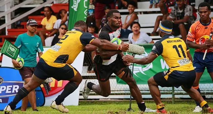 Northland hooker Osaia Seru makes a tackle against Naitasiri as winger Jo Kelekelevesi closes in at Ratu Cakobau Park, Nausori, today. Photo: Leon Lord.
