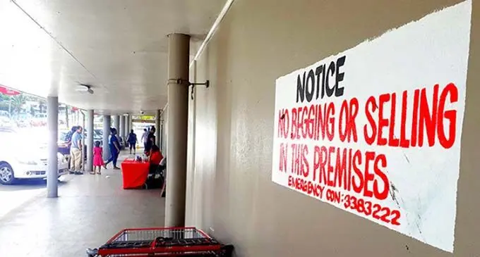 Sign outside Cost-U-Less in Suva that prohibits selling and begging around their premises.