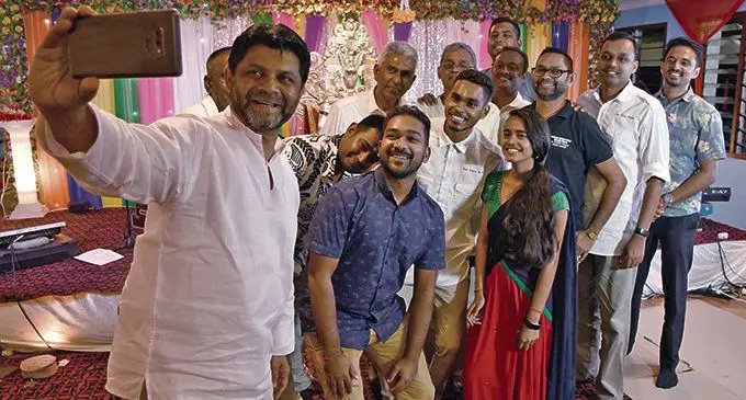 Attorney-General Aiyaz Sayed-Khaiyum takes a selfie with devotees after the Navratri Puja at the Koronivia Temple in Nausori. Photo: DEPTFO News
