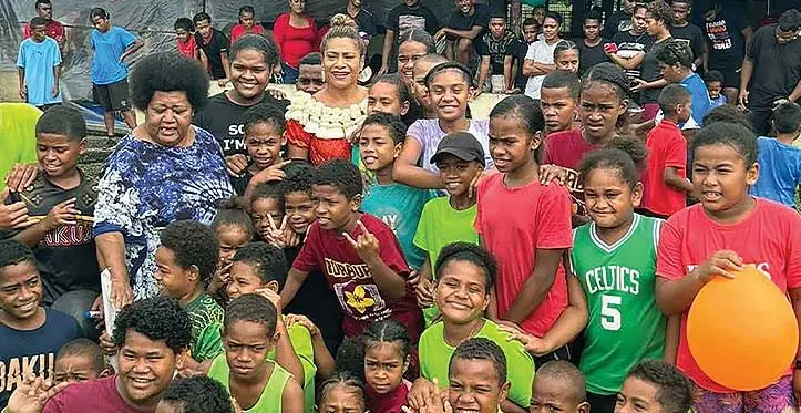Minister for Women, Children and Poverty Alleviation Lynda Tabuya (with garland), with children and residents of Nabua Topline Community during the fun day on May 15, 2023. Photo: Inoke Rabonu