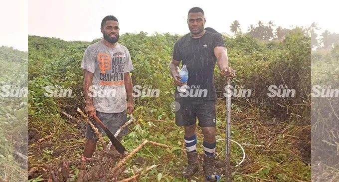 Siva Naulago (right), with brother in law Sikeli Lagilagi at the family farm.