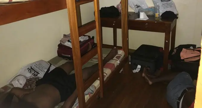 Picture show students squeezed into a small room at one house the Fiji Sun visited.
