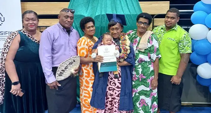 Alesi Ravouvou with her son, Sakiusa Avoi, and her family
