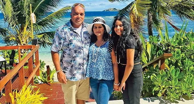 Pravineet Nand and his wife, Lorence, and daughter.
