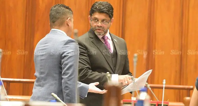 Supervisor of Election Mohammed Saneem (left) with Attorney General Aiyaz Sayed-Khaiyum in Parliament on September 1, 2022. Photo: Ronald  Kumar.