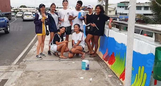 Year 11 students of International School Suva showing their work on Stinson Parade Bridge in Suva. Photo: Shalveen Chand
