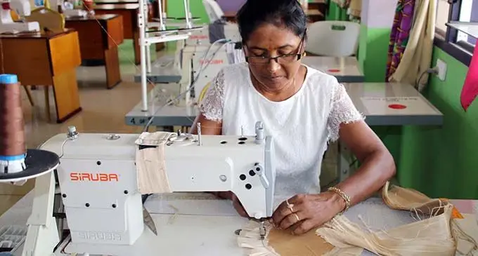 Nalini Devi sewing the Iri for FNU graduates .  Photo: FNU
