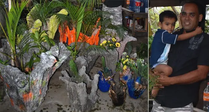 Alinesh Ram and his son with the pot plants he made from recycled material at his nursery at Wailoaloa, Nadi.  Photo: Mereleki Nai