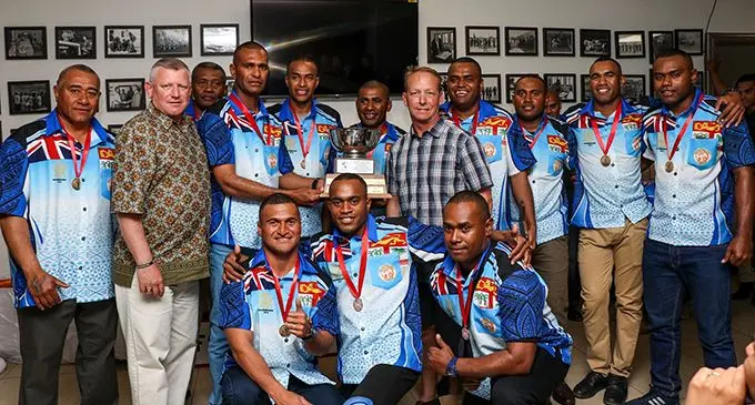 The Champion Team Benjamin and officials receive their awards from the Force Commander.  Photo: RFMF Media Cell