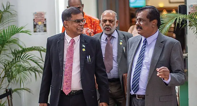 From left: Deputy Prime Minister and Minister for Finance Biman Prasad, Minister for Employment, Productivity and Industrial Relations Agni Dea Singh, and Fiji First Opposition member, Parmod Chand, outside parliament on May 24, 2024. Photo: Leon Lord