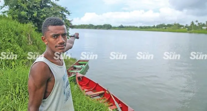 Wainisasa Settlement resident Kaminieli Rokodrugu points to the spot where Police found the body of the 50-year-old man at Baulevu, Nausori on February 14, 2022. Photo: Leon Lord