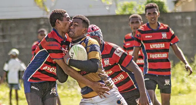 RKS forward Motikai Murry (right) takes on the Lomaivuna defence during the Vodafone Fiji Secondary Schools Rugby League match at St Marcellin Primary School ground in Vatuwaqa on the March 20, 2021. Photo- Leon Lord