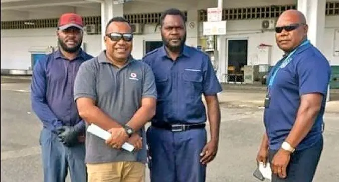 Pastor, Jone Isireli with relevant authority officers at Port Vila International Airport in Vanuatu. Photo: Vanuatu Daily Post