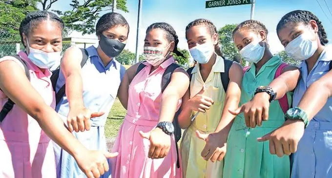 Suva Grammar School Year 9 and 11 students, (from left), Tima Vunisa, Berlissa Mario, Esther Valumasu, Lisi Ratumaitavuki, Fiona Namosimalua and Laisani Obitau express their joy as they returned to school on January 4, 2022.  Photo: Ronald Kumar