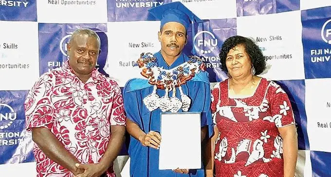 Senitki Biuwai Junior flanked by his parents Marica Bruce Biuwai and Seinitiki Biuwai Senior at the Fiji National University Lautoka Campus on February 12, 2021.  Photo: Salote Qalubau