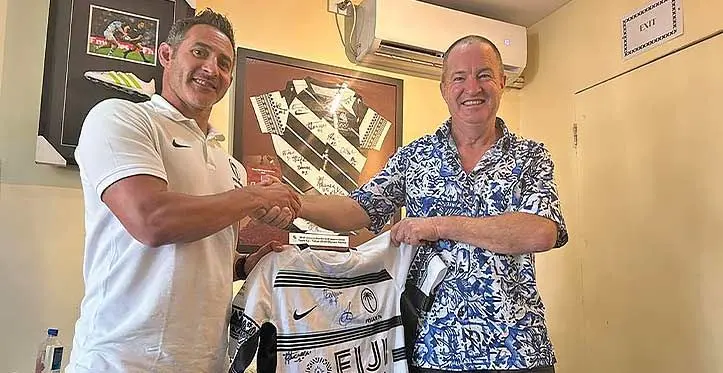Fiji Airways Fiji men’s rugby sevens coach Ben Gollings (left) hands over the jersey to Patrick James Sheehan at Rugby House, Suva, on August 10, 2023. Photo: Leon Lord