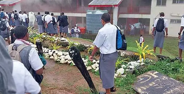Ratu Kadavulevu School students and teachers watch Sukuna House engulfed in flames on June 13, 2023. Photos: Facebook