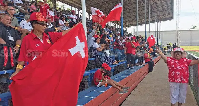 Left : Anna Lisa Tuinayanu with the Tongan flag during the Pacific Nations Cup clash at Churchill Park, Lautoka, on July 9, 2022. Photo: Waisea Nasokia
