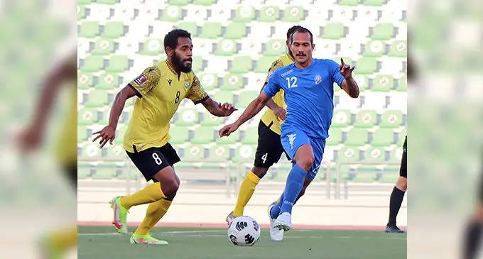 Digicel Fijian football midfielder Tevita Waranaivalu (right) defends against Vanuatu in the international match in Doha, Qatar. Photo: Fiji FA Media