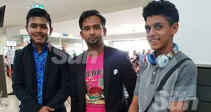 Kamil Muslim College students Alsheikh Ashad (left) and Shahil Hussain (right) with their science teacher, Rinal Prasad (middle) at the Nadi International Airport on January 18, 2020. Photo: Nicolette Chambers