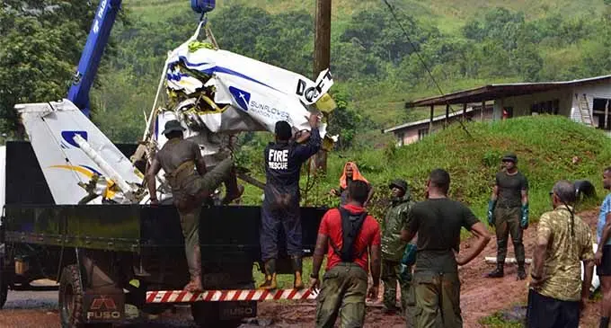 The recovery team help load pieces of the Cessna 172 plane wreck on March 8, 2018 after it was airlifted by helicopter from the crash site in the Delaikoro Ridge in Macuata.  Photo: Wati Talebula