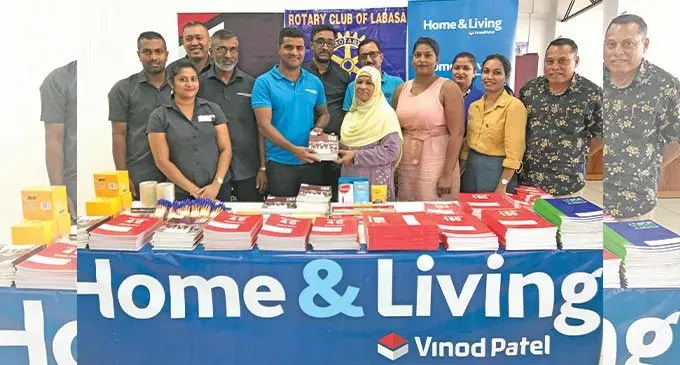 Home & Living staff with their general manager Ronald Narayan (centre left) during the handing over of stationery to Rotary Club Labasa member, Nazma Ibrahim, witnessed by other club members in Labasa on June 10, 2022. Photo: Shratika Naidu