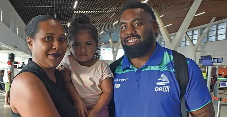 Swire Shipping Fijian Drua tighthead prop Samuela Tawake with fans at Nadi International Airport on April 19, 2023. Photo: Mereleki Nai