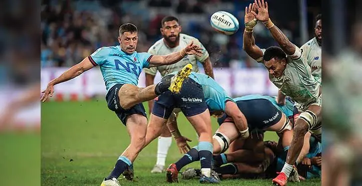 Swire Shipping Fijian Drua openside flanker Vilive Miramira blocks a kick from a Waratahs player during their round 14 Shopn N Save Super Rugby Pacific match at Allianz Stadium, Sydney, Australia on May 20, 2023. Photo: Leon Lord