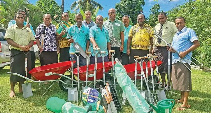 Adventist Development and Relief Agency Fiji country director, Iliapi Tuwai (fifth from right) with the members of the three Lautoka church groups who were assisted with agricultural kits on March 17, 2021. Photo: Kathrin Krishna