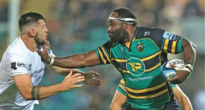 Northampton Saints lock, Api Ratuniyarawa (right) fends off an Ospreys player during their match on September 10, 2021. 