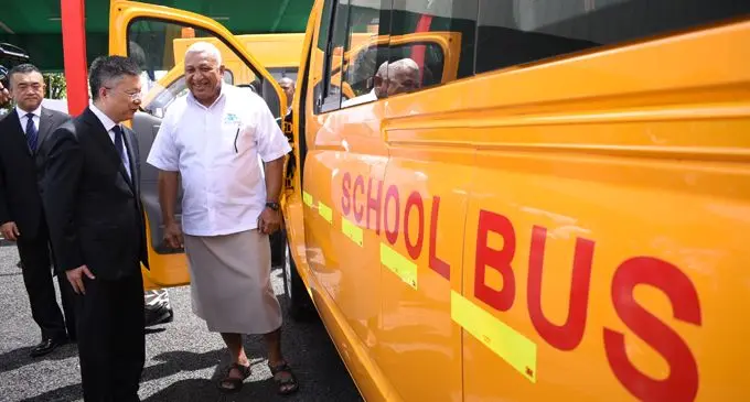 Prime Minister Voreqe Bainimarama received 50 school buses as part of the 200 vehicle handover from the Chinese Ambassador to Fiji Qian Bo in Suva on February 22, 2018. Photo: Ronald Kumar
