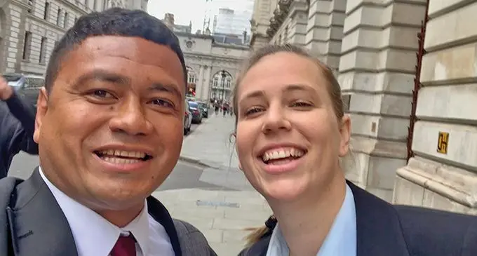 Actor David Johnson (left), takes a selfie with an actress on the set of The Diplomat.