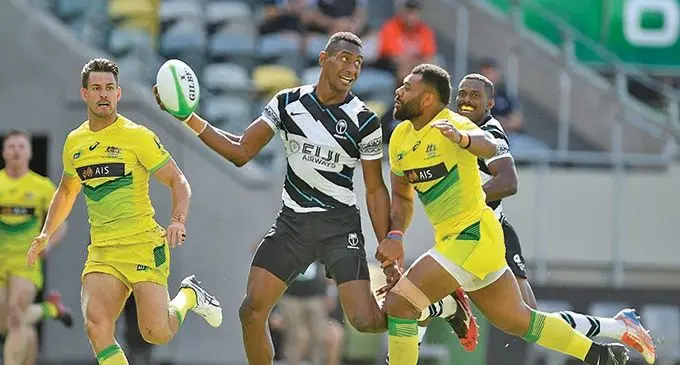 Josefa Talacolo (with ball) looks for support as Samu Kerevi of Australia closes in during the Oceania tournament in Townsville, Australia in July . Photo: Oceania Rugby