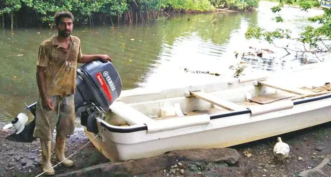 Ashneel Prasad with his boat and engine that was funded by an Nothern Development Programme grant at Dala Settlement February 15, 2018. Photo: Wati Talebula