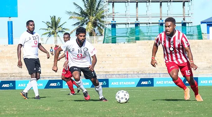 Labasa midfielder Ilisoni Logaivau (right) makes his move as Suva captain Ravinesh Karan Singh closes in during the Vodafone Premier League clash at the ANZ Stadium, Suva on August 30, 2020. Photo: Kelera Sovasiga