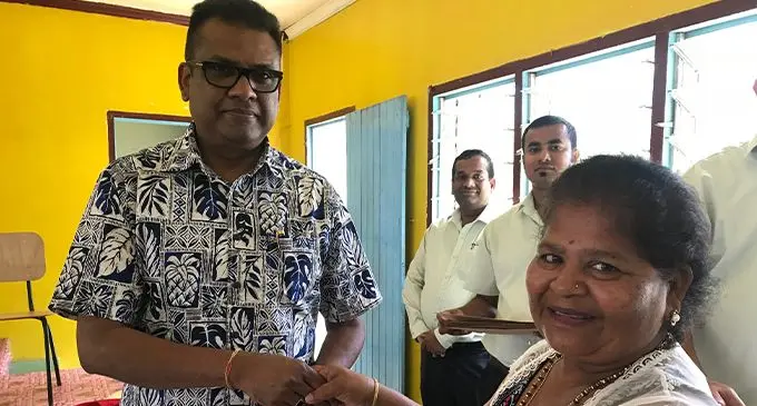 Savita Devi (right) of Nawaicoba receiving her lease from the Permanent Secretary for Sugar Yogesh Karan (left). Photo: Charles Chambers