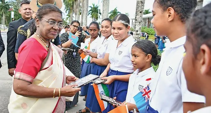 President of the world’s largest democracy broke protocol to personally thank students who waited outside the Grand Pacific Hotel on Tuesday August 6, 2024. Her Excellency Droupadi Murmu spoke to at least five students of St. Anne’s Primary School and distributed chocolates. She asked for their names and what year they were in. President Murmu was on her way to the traditional welcome ceremony hosted by the Prime Minister. Students were impressed with her simplicity in both speech and attire. The Indian President is a former teacher. Photo: Ronald Kumar