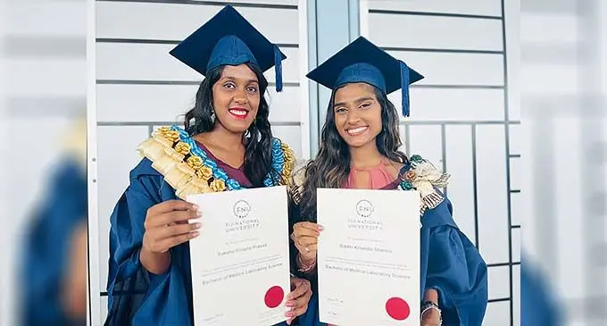 From left: Fiji National graduates, Raksha Rinisha Prasad and Siddhi Krismita Sharma at the Vodafone Arena in Suva on December 22, 2022. Photo: Nolishma Narayan